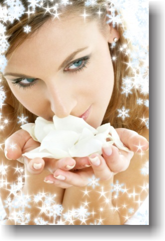 image of woman smelling flower